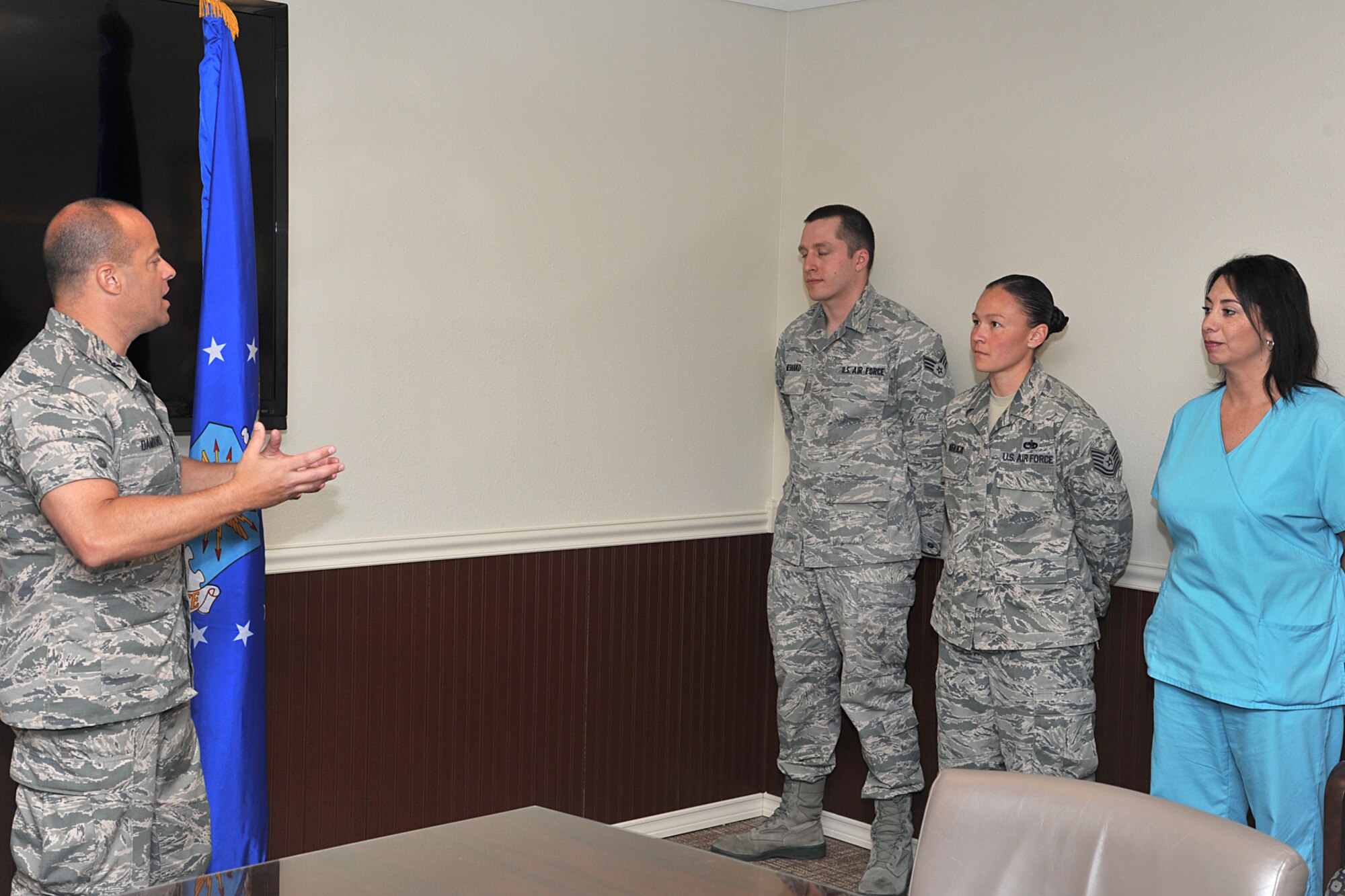 GOODFELLOW AIR FORCE BASE, Texas -- Col. Mark Damiano, 17th Training Wing Commander, thanks three 17th Medical Group members for their recent hard work and accomplishments, March 22. Damiano did a walk though of several squadrons on Goodfellow to show appreciation to individuals and their coworkers. (U.S. Air Force photo/ Airman 1st Class Michael Smith)