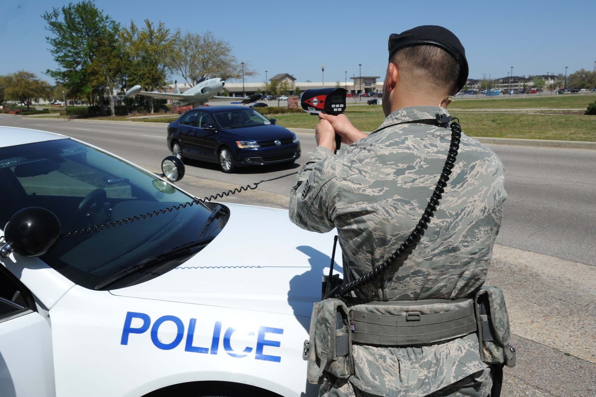 Tech. Sgt. Benjamin Collins, 81st Security Forces Squadron, enforces the speed limit with a radar detector on Larcher Boulevard March 25, 2013, at Keesler Air Force Base, Miss.  The 81st SFS offers a ride-along program for anyone interested in learning more about Air Force law enforcement.  (U.S. Air Force photo by Kemberly Groue)