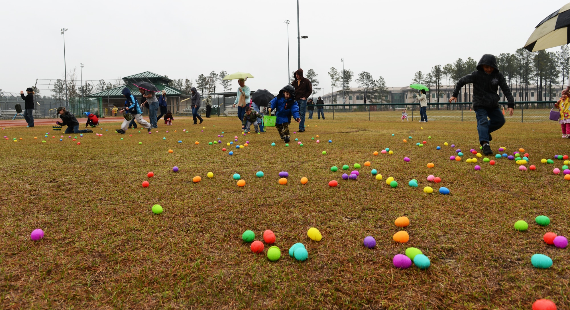 About 100 children from Team Shaw race around the base sports complex to collect approximately 1,500 Easter eggs, Shaw Air Force Base, S.C., March 23, 2013. As part of the annual Military Child Carnival, sponsored by the Shaw Youth Programs, children of Team Shaw members were invited to participate in an Easter egg hunt. (U.S. Air Force photo by Senior Airman Tabatha Zarrella/Released)
