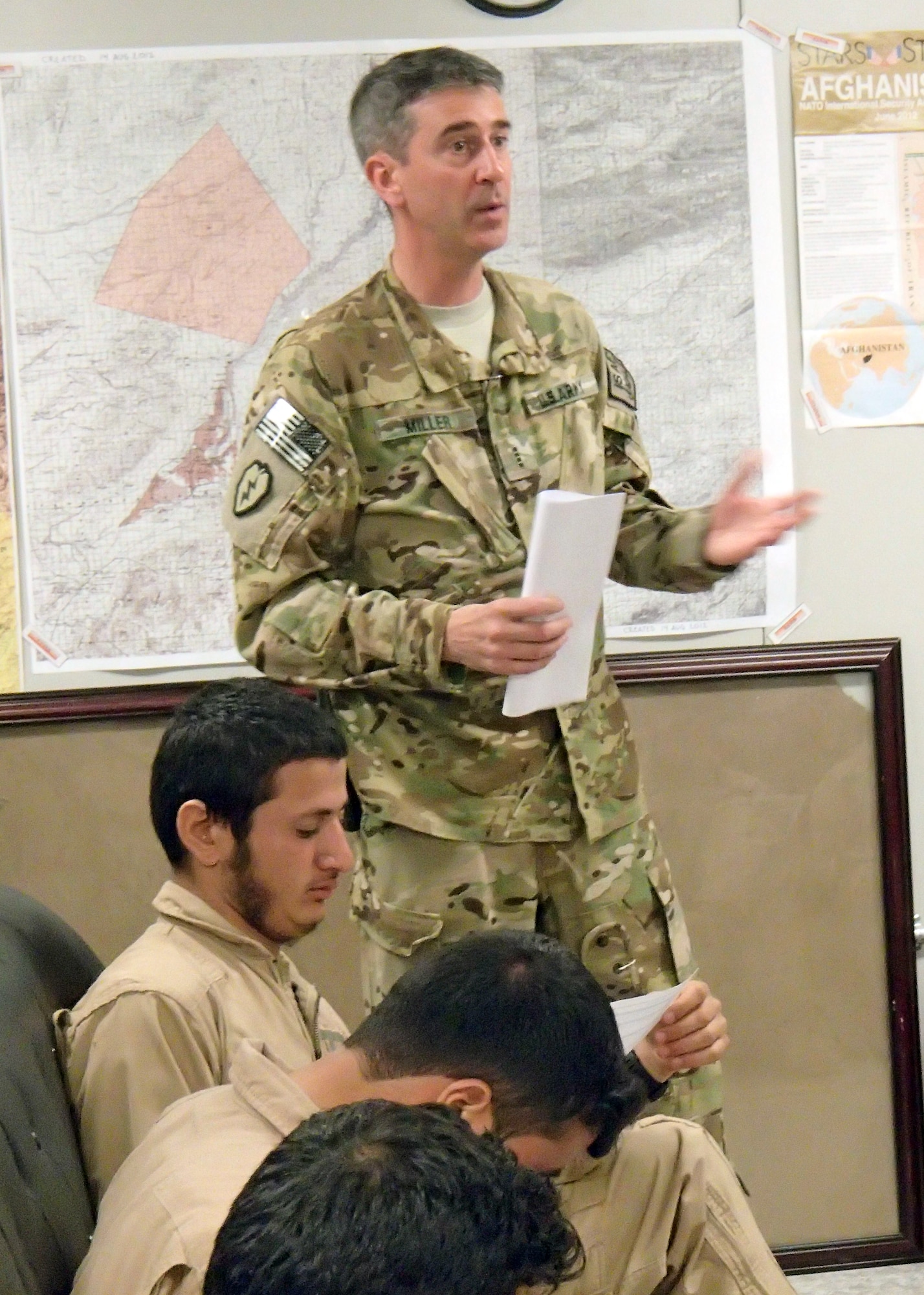 Chief Warrant Officer 4 Andy Miller, MD-530 team standardization pilot advisor, gives a lesson on night operations and how to properly use night vision goggles prior to a training mission March 19, 2013, at Shindand Air Base, Afghanistan. The current class going through NVG training, with eight students, is the largest class as well as only the third class to go through the training at SAB. NVG training is taught by air advisors from the 444th Air Expeditionary Advisory Squadron. (U.S. Air Force photo/Capt. Anastasia Wasem)