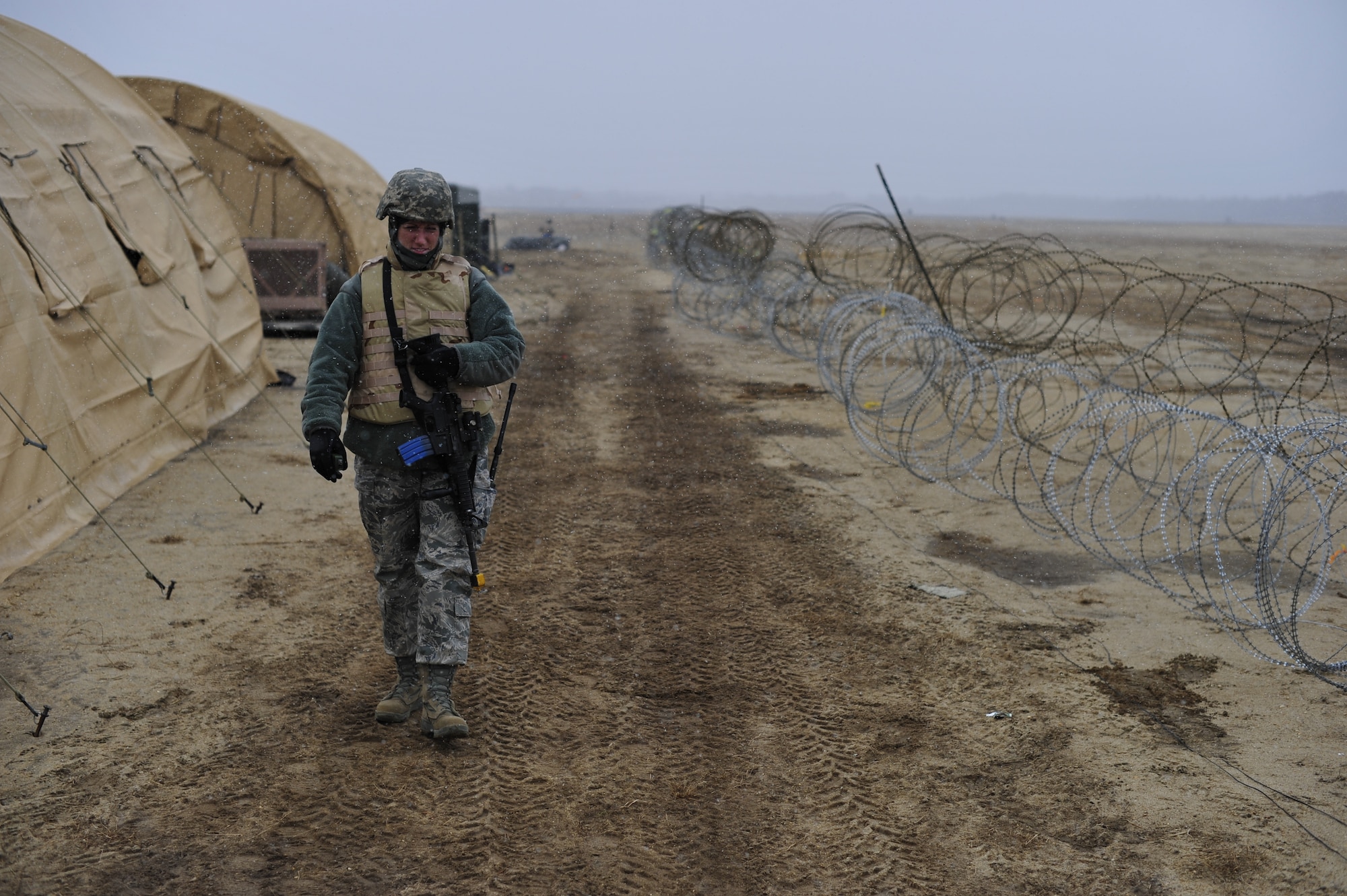 JOINT BASE MCGUIRE-DIX-LAKEHURST, N.J. -- U.S. Air Force Staff Sgt. Kim Cribbs, 817th Global Mobility Readiness Squadron weather technician, conducts a camp foot patrol as a security forces augmentee on Lakehurst during exercise Eagle Flag 13-2 March 19, 2013. Cribbs is a member of the 621st Contingency Response Wing stationed at JB MDL and is supporting the validation of a Joint Task Force – Port Opening team.  (U.S. Air Force photo by Tech. Sgt. Parker Gyokeres/Released) 