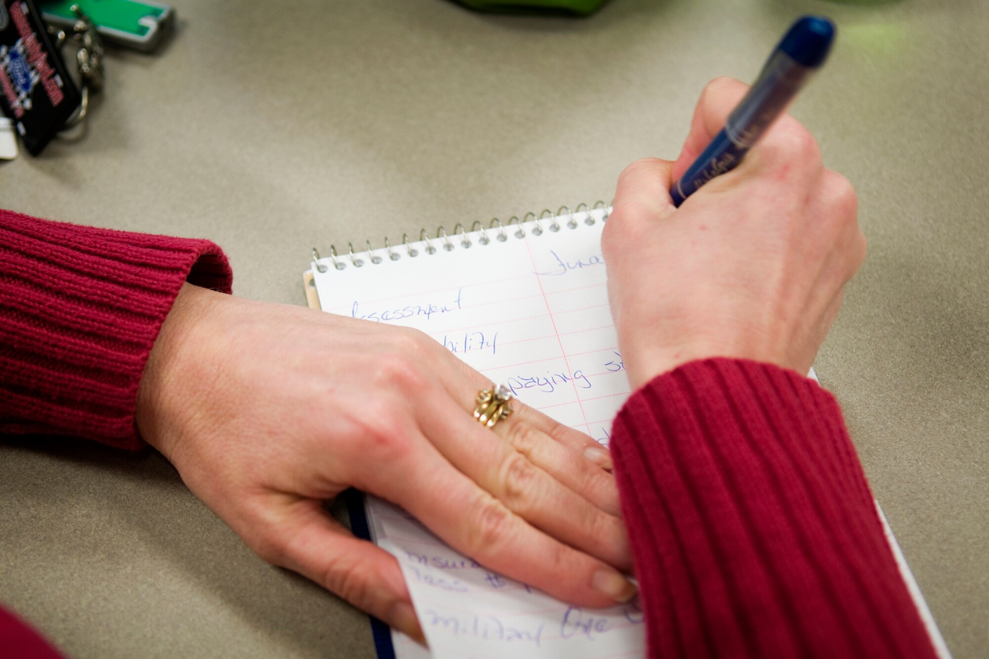 GRISSOM AIR RESERVE BASE, Ind. -- Amy Gilbert, 434th Mission Support Group budget technician, takes notes during a savings and investing class put on by Alice Howe, a military family life consultant and certified financial planner here March 13. Howe holds classes every other Thursday at the Grissom Airman and Family Readiness Center to help base personnel best manage their finances. (U.S. Air Force photo/Tech. Sgt. Mark R. W. Orders-Woempner)	

