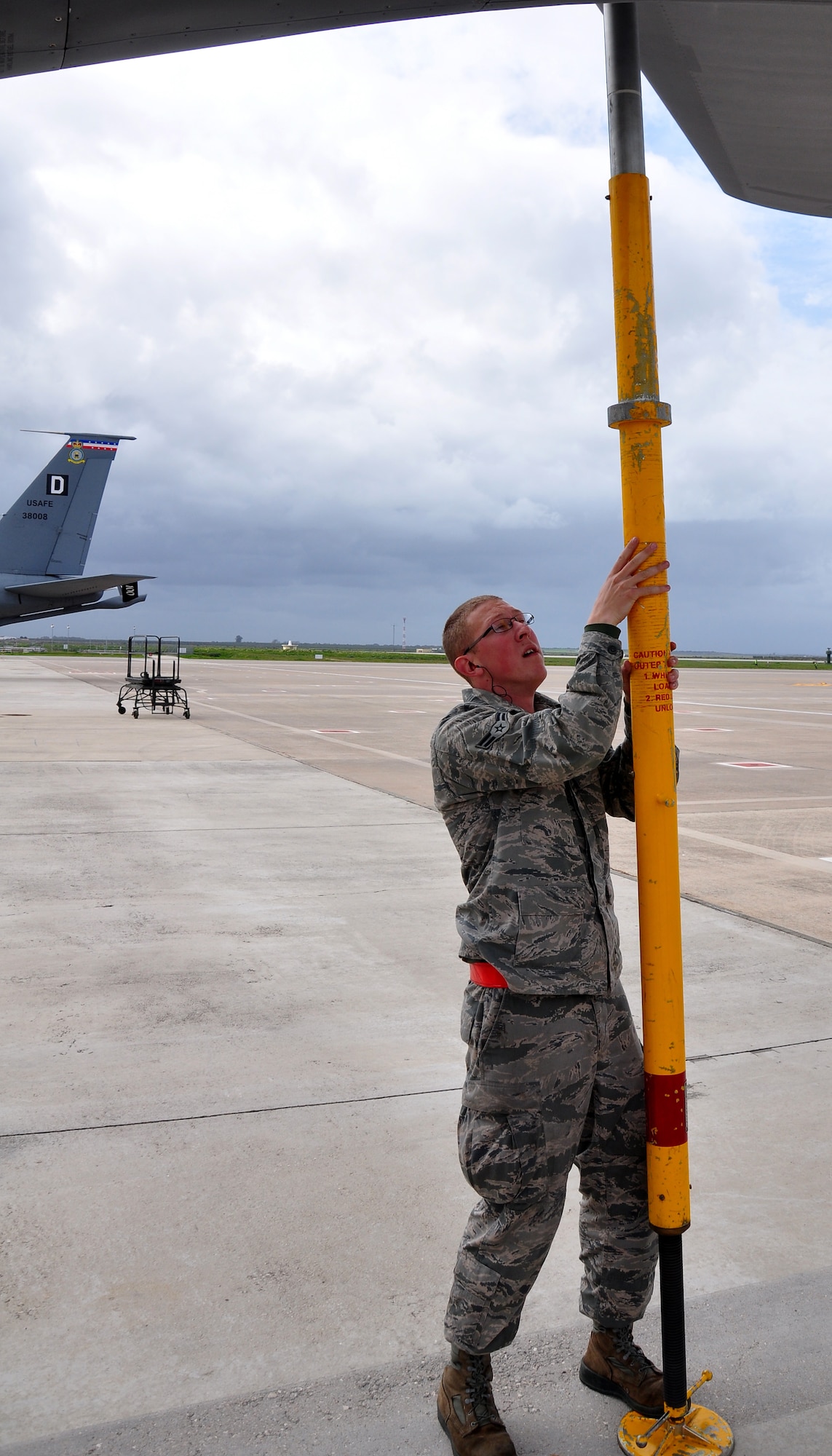 Airman 1st Class Colton Williams, 100th Aircraft Maintenance Squadron, installs a tail stand on a KC-135 Stratotanker after a mission March 25, 2013. Airmen and aircraft deployed from the 100th Air Refueling Wing, RAF Mildenhall, England, to southwest Europe as the 351st Expeditionary Air Refueling Squadron Jan. 26, 2013. The 351st EARS has completed more than 120 sorties supporting French fighter aircraft conducting operations in Mali. The sorties include more than 5.5 million pounds of fuel transferred. (U.S. Air Force photo by Capt. Jason Smith)