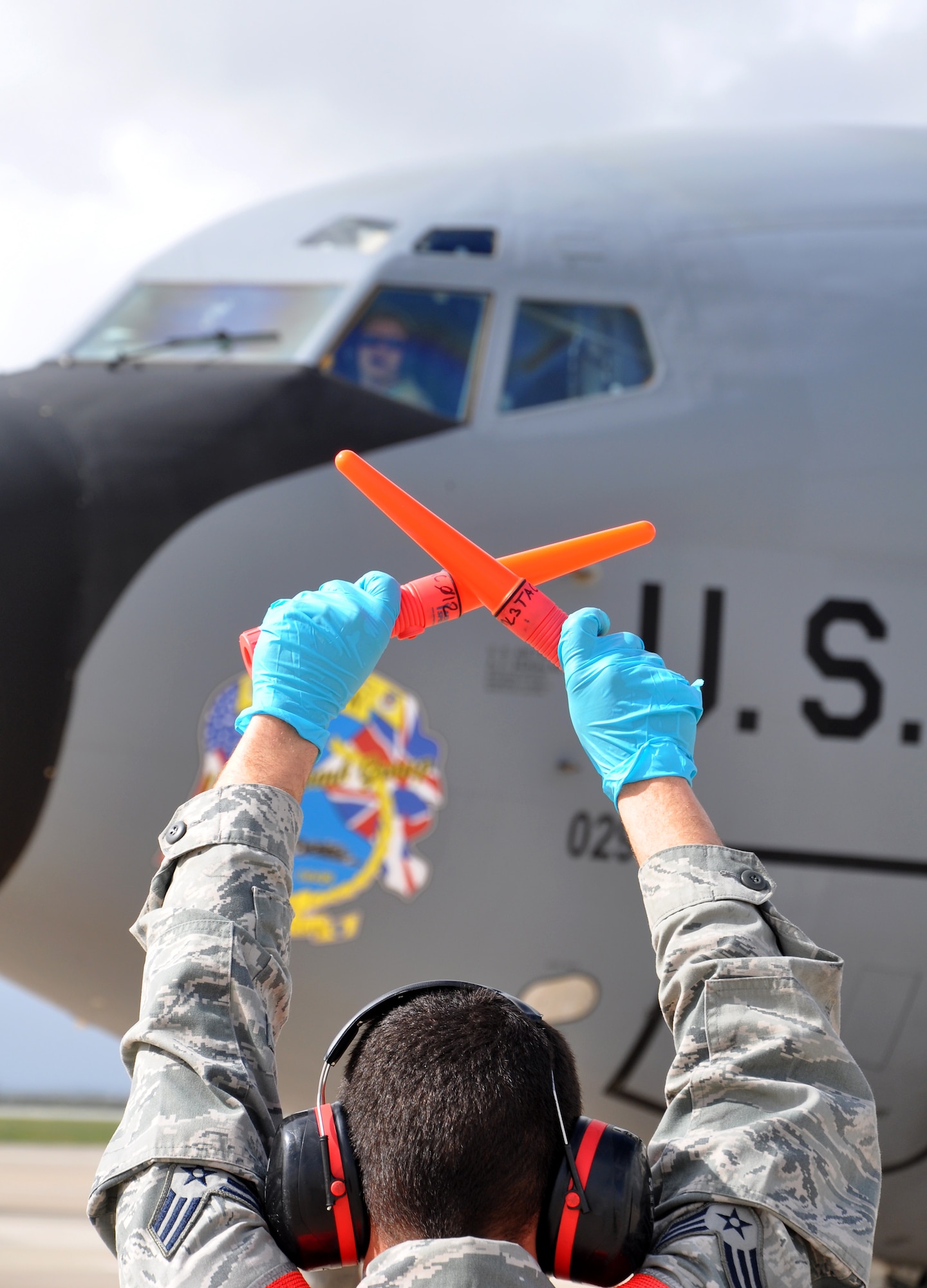 Senior Airmen Maverick Jones, 100th Aircraft Maintenance Squadron, completes marshaling a KC-135 Stratotanker after a mission March 25, 2013. Airmen and aircraft deployed from the 100th Air Refueling Wing, RAF Mildenhall, England, to southwest Europe as the 351st Expeditionary Air Refueling Squadron Jan. 26, 2013. The 351st EARS has completed more than 120 sorties supporting French fighter aircraft conducting operations in Mali. The sorties include more than 5.5 million pounds of fuel transferred. (U.S. Air Force photo by Capt. Jason Smith)