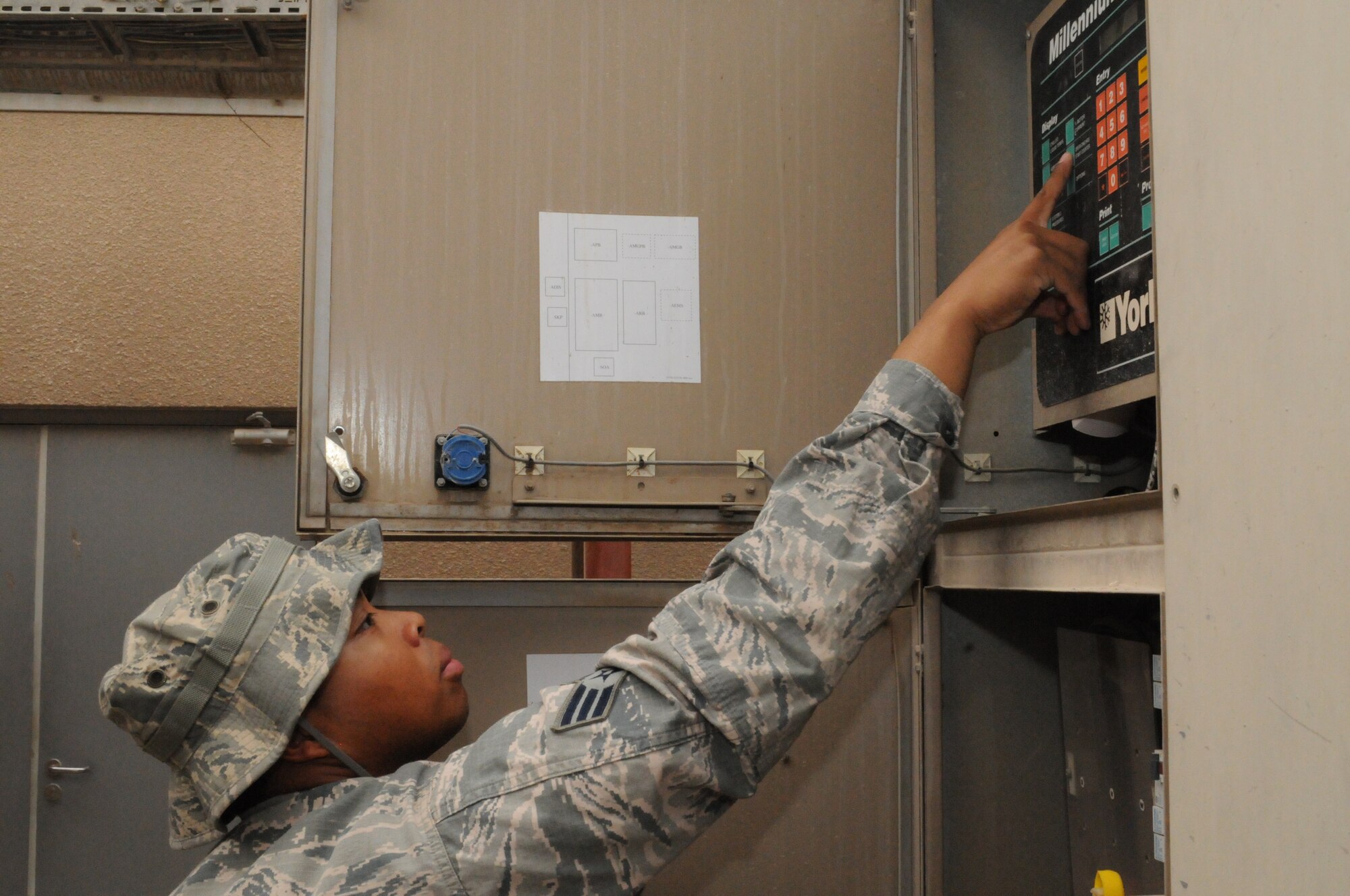SOUTHWEST ASIA -- Senior Airman David Murriel performs an operations check on a chiller unit serving the Blatchford-Preston Complex Mall, March 21. The 379th Expeditionary Civil Engineer Squadron Heating Ventilation Air Conditioning / Refrigeration shop maintains all wing and tenant HVAC/R systems on base. (U.S. Air Force photo/Master Sgt. Christian Michael)