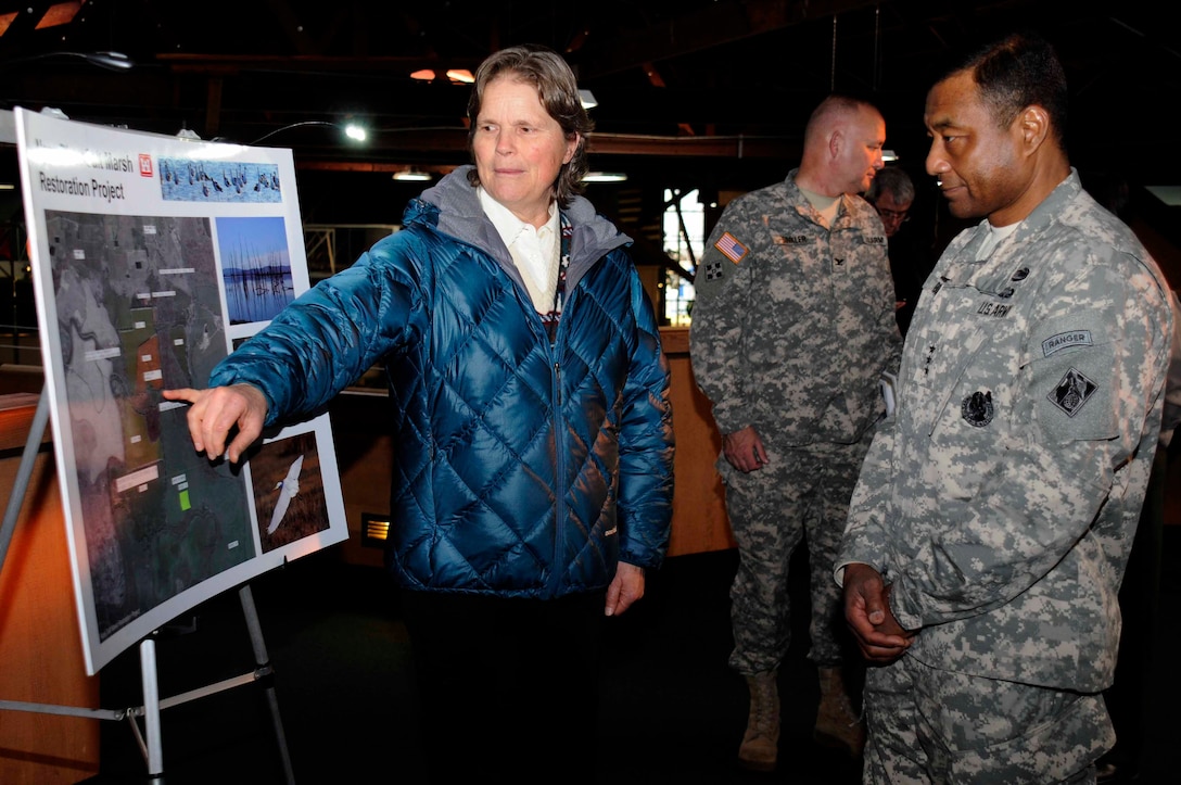 Karen Rippey, San Francisco District, briefs Lieutenant General Thomas P. Bostick, Commanding General and Chief of Engineers, on the Napa Salt Marsh Restoration during his tour of the Bay Model Visitor Center in Sausalito, CA as part of his visit of the district on Jan. 17.