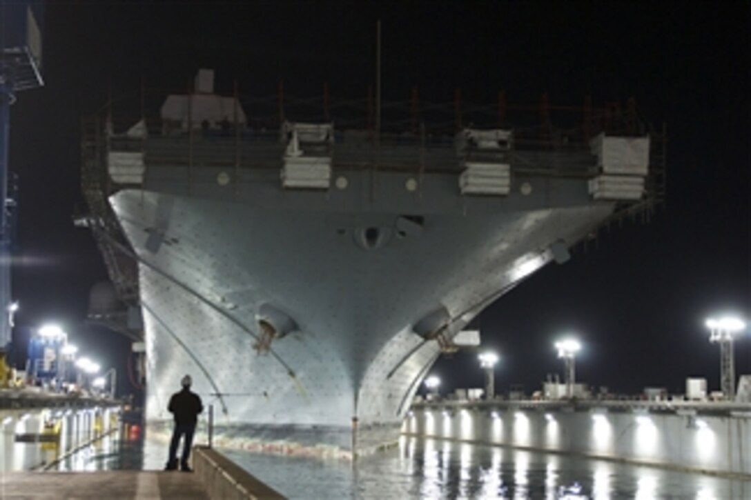 The amphibious assault ship USS Essex (LHD 2) enters a dry dock at the National Steel and Shipbuilding Company in San Diego, Calif., on March 24, 2013.  The ship will undergo an 18-month maintenance and upgrade period and expects to return to the fleet in 2014.  