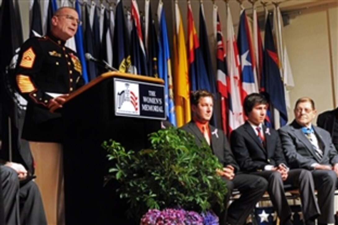 Marine Corps Sgt. Maj. Bryan B. Battaglia, senior enlisted advisor to the chairman of the Joint Chiefs of Staff, speaks at an event at the Women in Military Service for America Memorial marking the 150th anniversary of the award of the first Medal of Honor and honoring citizen heroes in Washington, D.C., March 25, 2013.