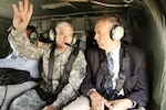 NYS Governor George E. Pataki surveys the flood damage to New York's Southern Tier with Maj. Gen. Joseph J. Taluto, The Adjutant General for the New York National Guard. Approximately 350 New York National Guard Soldiers responded for evacuations and rescues during the late June flooding. Engineer Soldiers continue to provide recovery assistance in communities affected by the historic flood levels.