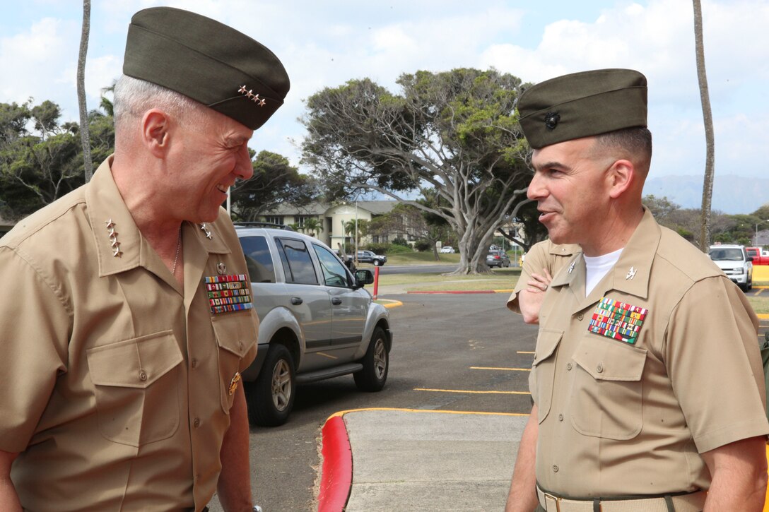 The Assistant Commandant of the Marine Corps, Gen. John M. Paxton, Jr., visits with Marines and Sailors from Third Marines Division, U.S. Marine Corps base Hawaii, March 8, 2013. The trip is part of a larger West Pacific trip. (U.S. Marine Corps photo by Cpl. Tia Dufour/Released)