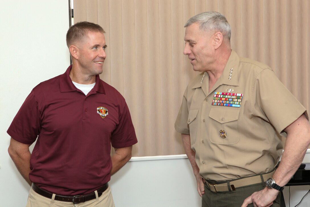 The Assistant Commandant of the Marine Corps, Gen. John M. Paxton, Jr., visits with Marines and Sailors from Third Marines Division, U.S. Marine Corps base Hawaii, March 8, 2013. The trip is part of a larger West Pacific trip. (U.S. Marine Corps photo by Cpl. Tia Dufour/Released)