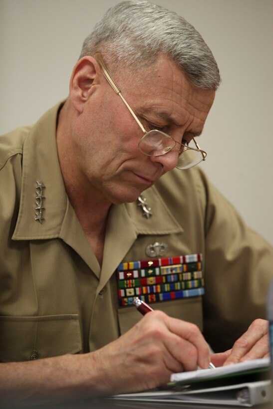 The Assistant Commandant of the Marine Corps, Gen. John M. Paxton, Jr., visits with Marines and Sailors from Third Marines Division, U.S. Marine Corps base Hawaii, March 8, 2013. The trip is part of a larger West Pacific trip. (U.S. Marine Corps photo by Cpl. Tia Dufour/Released)