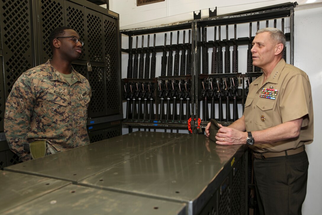 The Assistant Commandant of the Marine Corps, Gen. John M. Paxton, Jr., visits with Marines and Sailors from Third Marines Division, U.S. Marine Corps base Hawaii, March 8, 2013. The trip is part of a larger West Pacific trip. (U.S. Marine Corps photo by Cpl. Tia Dufour/Released)
