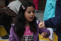 The daughter of a Marine with Combat Logistics Battalion 6, 2nd Marine Logistics Group looks excitedly at the prize in one of the eggs found during an Easter egg hunt aboard Camp Lejeune, N.C., March 23, 2013. The family readiness officer for CLB-6 helped plan the event to build connections between the families in preparation for the battalion’s upcoming deployment. 