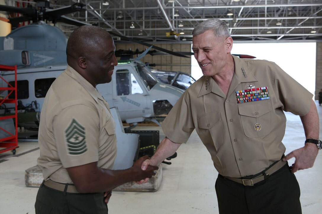 The Assistant Commandant of the Marine Corps, Gen. John M. Paxton, Jr., visits with Marines and Sailors from Third Marines Division, U.S. Marine Corps base Hawaii, March 8, 2013. The trip is part of a larger West Pacific trip. (U.S. Marine Corps photo by Cpl. Tia Dufour/Released)
