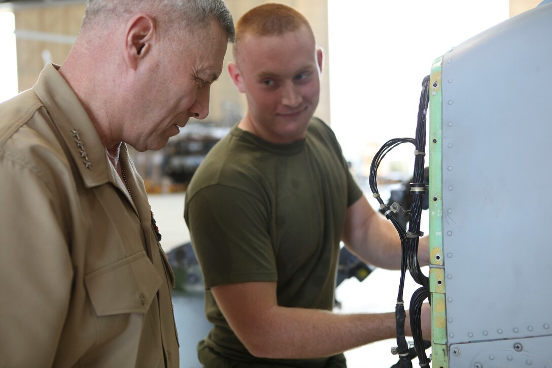 The Assistant Commandant of the Marine Corps, Gen. John M. Paxton, Jr., visits with Marines and Sailors from Third Marines Division, U.S. Marine Corps base Hawaii, March 8, 2013. The trip is part of a larger West Pacific trip. (U.S. Marine Corps photo by Cpl. Tia Dufour/Released)