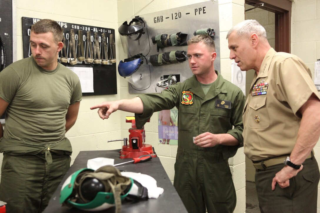 The Assistant Commandant of the Marine Corps, Gen. John M. Paxton, Jr., visits with Marines and Sailors from Third Marines Division, U.S. Marine Corps base Hawaii, March 8, 2013. The trip is part of a larger West Pacific trip. (U.S. Marine Corps photo by Cpl. Tia Dufour/Released)