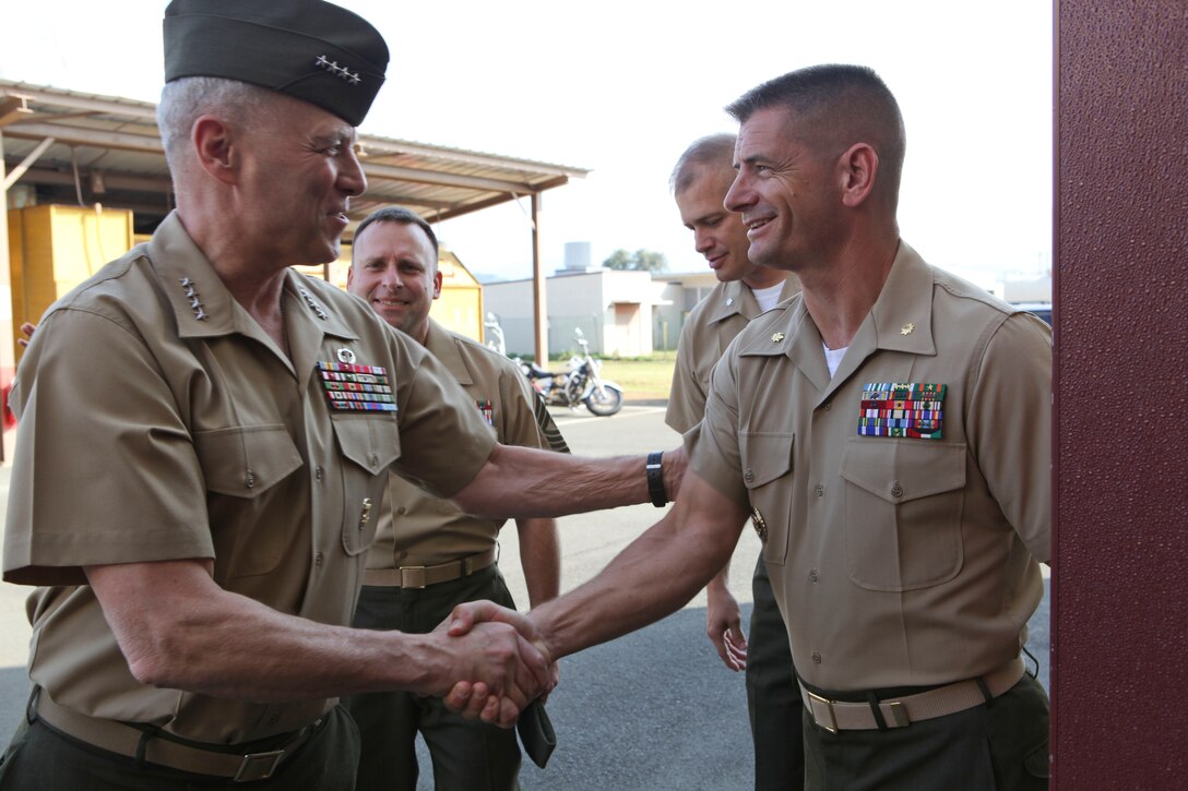 The Assistant Commandant of the Marine Corps, Gen. John M. Paxton, Jr., visits with Marines and Sailors from Third Marines Division, U.S. Marine Corps base Hawaii, March 8, 2013. The trip is part of a larger West Pacific trip. (U.S. Marine Corps photo by Cpl. Tia Dufour/Released)