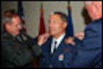 121st Air Refueling Wing Vice Wing Commander Col Robert L. Boggs being pinned as Brigadier General by the Ohio National Guard Adjutant General Major General Gregory L. Wayt and the Assistant Adjutant for Air, Major General A.J. Feucht at a pinning ceremony at Rickenbacker Air National Guard base on 31 July 2006.