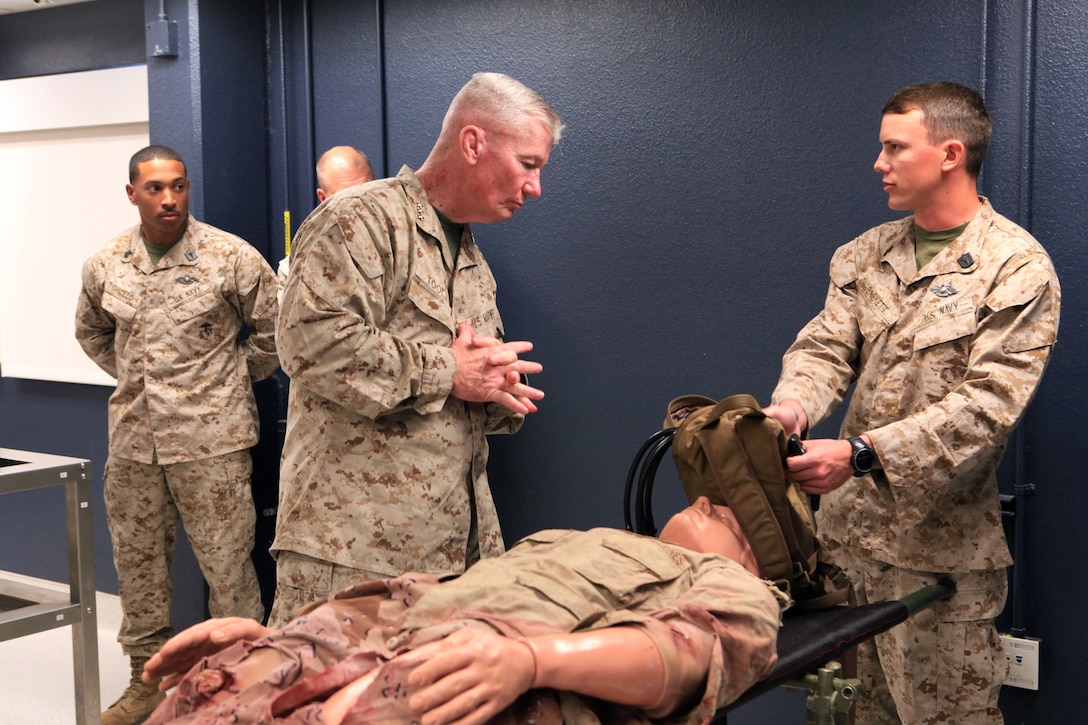 Lt. Gen. John A. Toolan Jr., the commanding officer of I Marine Expeditionary Force, views a medical display at Field Medical Training Battalion West, following a graduation ceremony for Navy corpsmen at Camp Pendleton, Calif., March 22.