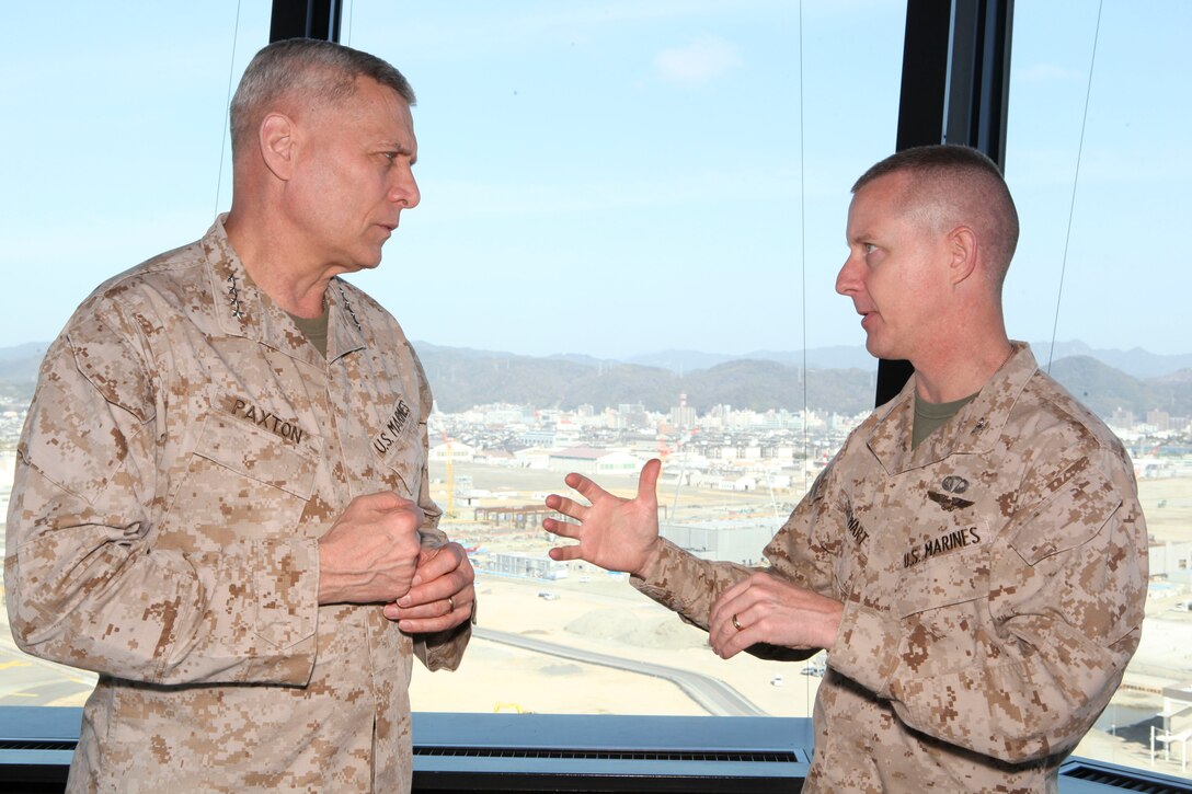 The Assistant Commandant of the Marine Corps, Gen. John M. Paxton, Jr., spaks with Col. James Stewart while on a base tour of Marine Corps Air Station Iwakuni, Japan, March 11, 2013. The tour was hosted by Col. James Stewart. (U.S. Marine Corps photo by Cpl. Tia Dufour/Released)