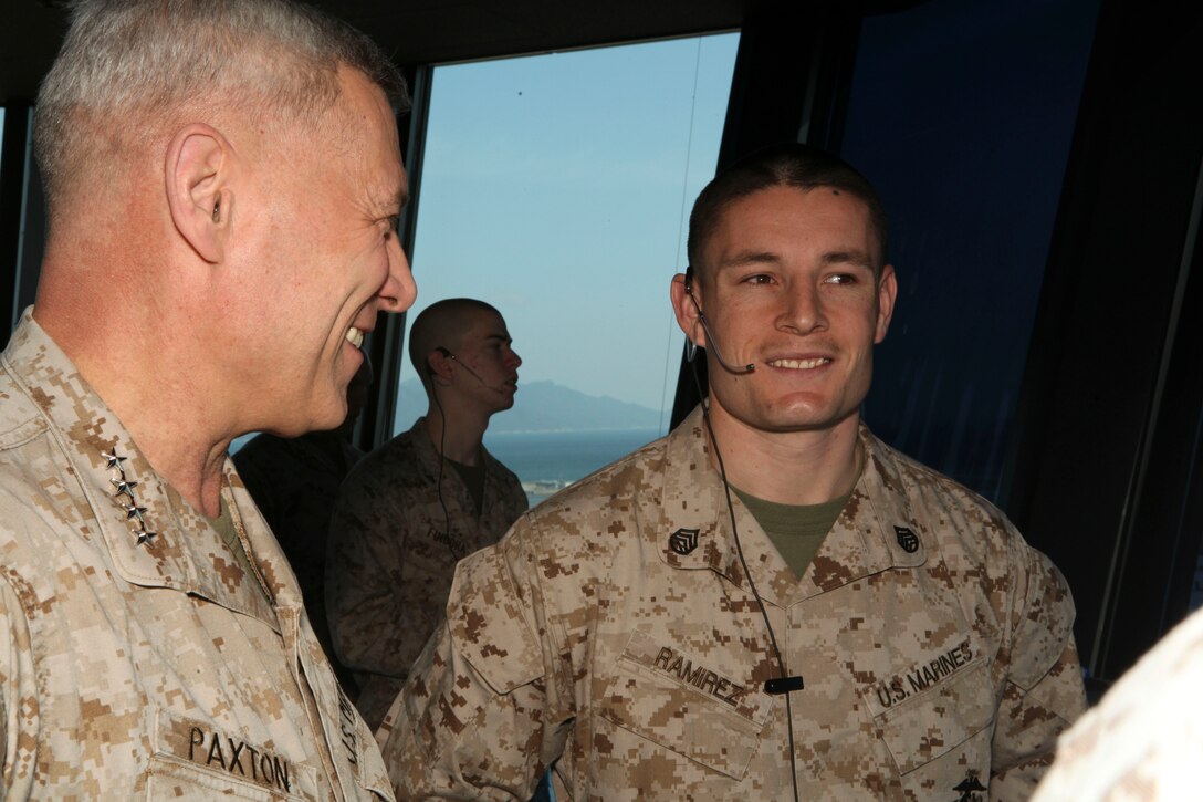 The Assistant Commandant of the Marine Corps, Gen. John M. Paxton, Jr., visits with Marines while on a base tour of Marine Corps Air Station Iwakuni, Japan, March 11, 2013. The tour was hosted by Col. James Stewart. (U.S. Marine Corps photo by Cpl. Tia Dufour/Released)