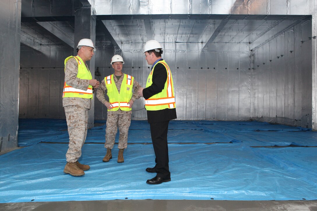 The Assistant Commandant of the Marine Corps, Gen. John M. Paxton, Jr., visits with Marines while on a base tour of Marine Corps Air Station Iwakuni, Japan, March 11, 2013. The tour was hosted by Col. James Stewart. (U.S. Marine Corps photo by Cpl. Tia Dufour/Released)