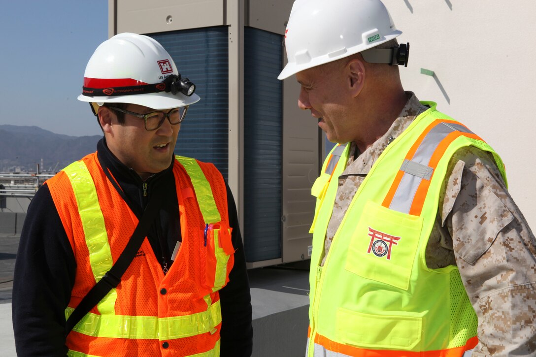 The Assistant Commandant of the Marine Corps, Gen. John M. Paxton, Jr., visits with Marines while on a base tour of Marine Corps Air Station Iwakuni, Japan, March 11, 2013. The tour was hosted by Col. James Stewart. (U.S. Marine Corps photo by Cpl. Tia Dufour/Released)