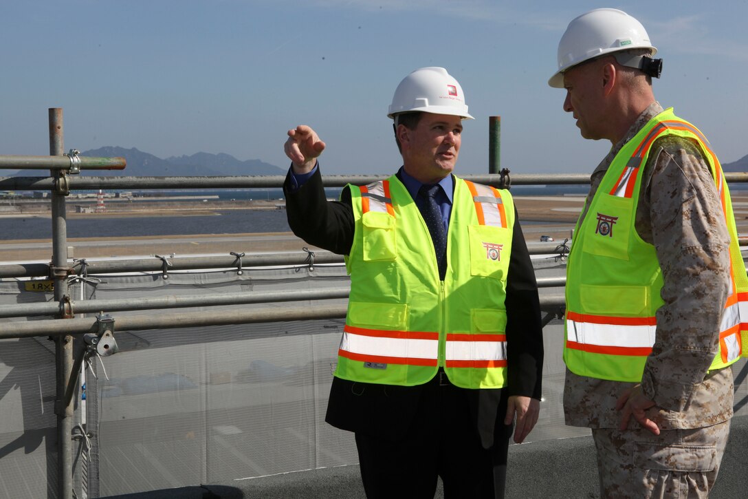 The Assistant Commandant of the Marine Corps, Gen. John M. Paxton, Jr., visits with Marines while on a base tour of Marine Corps Air Station Iwakuni, Japan, March 11, 2013. The tour was hosted by Col. James Stewart. (U.S. Marine Corps photo by Cpl. Tia Dufour/Released)