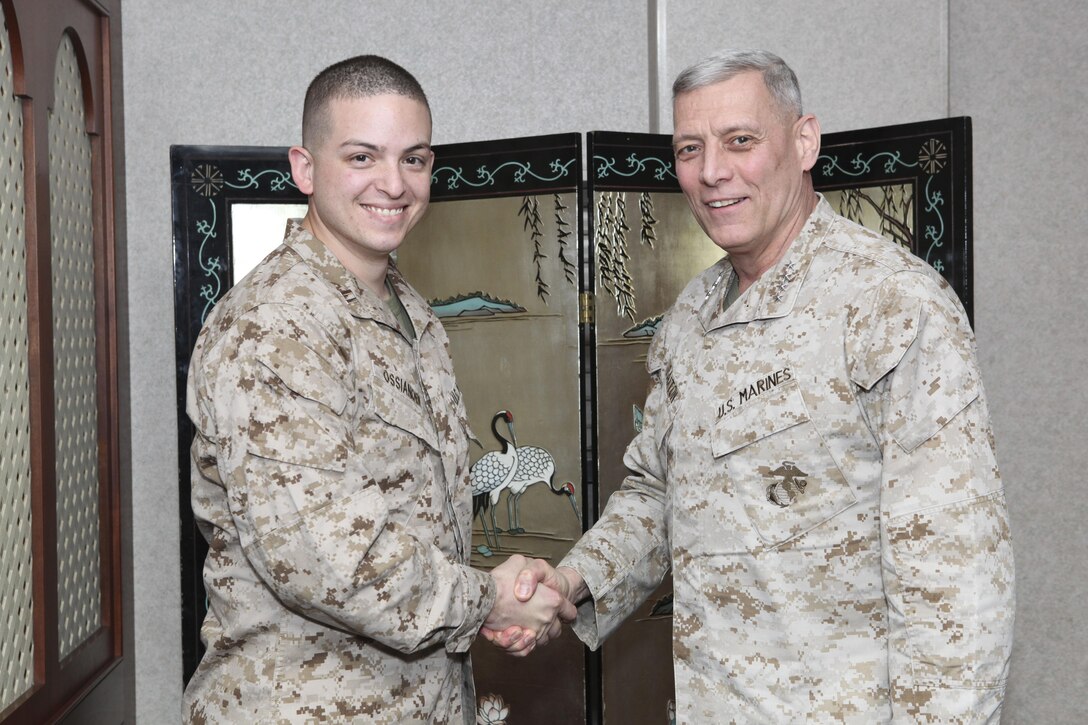 The Assistant Commandant of the Marine Corps, Gen. John M. Paxton, Jr., visits with Marines while on a base tour of Marine Corps Air Station Iwakuni, Japan, March 11, 2013. The tour was hosted by Col. James Stewart. (U.S. Marine Corps photo by Cpl. Tia Dufour/Released)