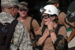 Cadet Veronica Kool, a ROTC candidate of the 135th Chemical Company headquartered in Machesney Park, Ill, gears up for the training exercise at the Gateway International Speedway to increase homeland security in Illinois.