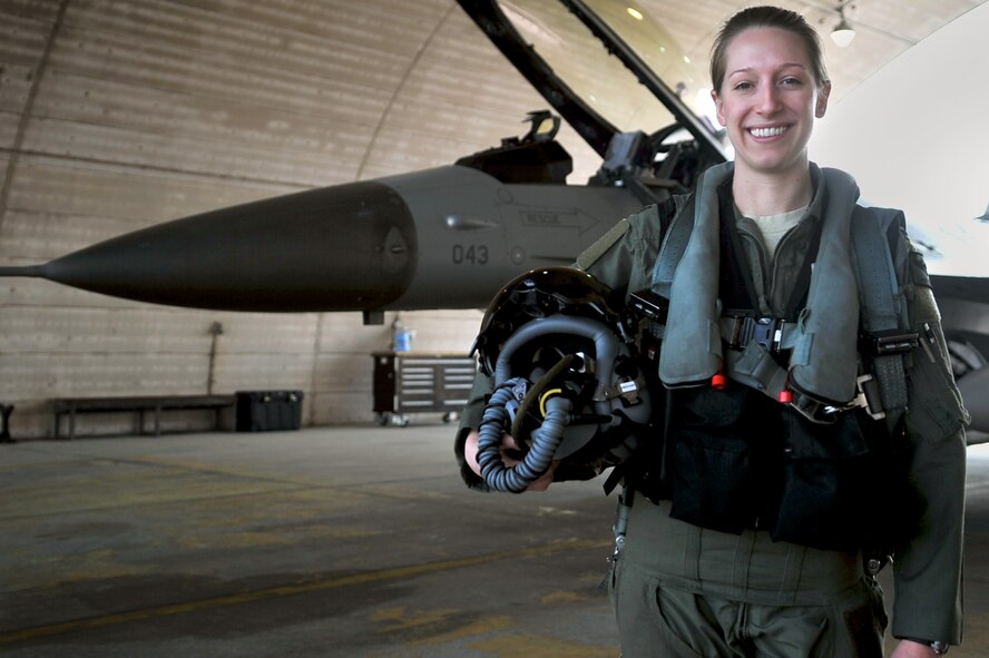 First Lt. Clancy Morrical, 36th Fighter Squadron pilot, stands by her F-16 Fighting Falcon. Morrical is Osan’s only female pilot. (U.S. Air Force photo/Senior Airman Alexis Siekert)