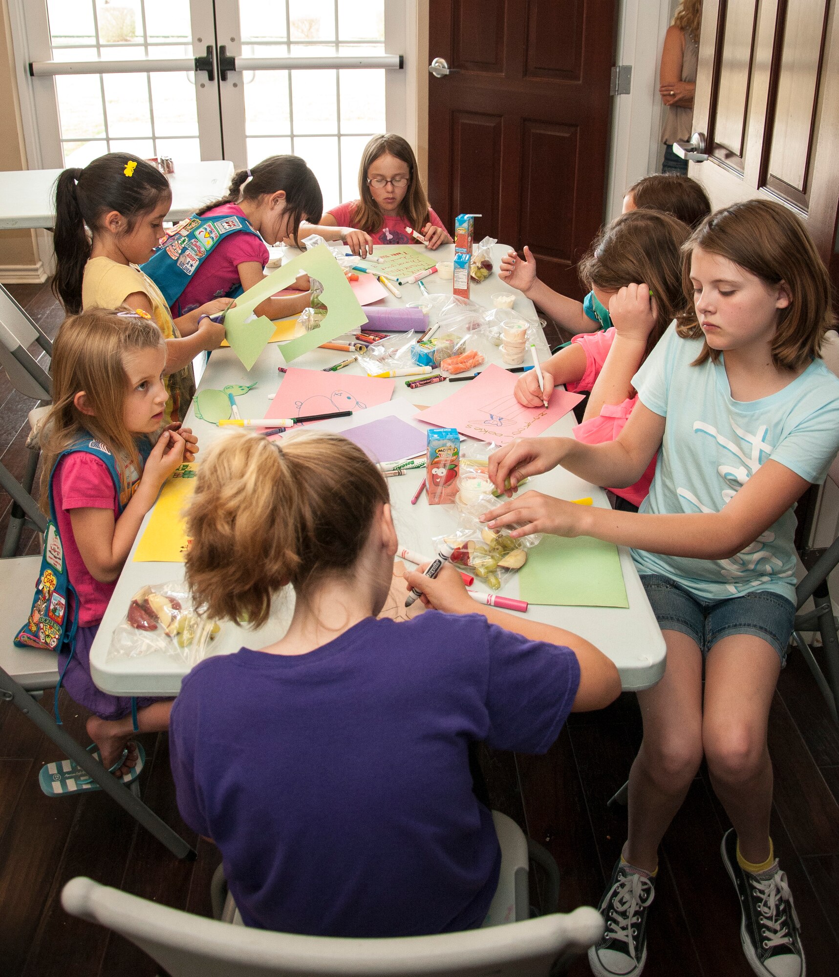 Girl Scout Troop 1168 members make hand-made thank you cards to send to deployed Laughlin troops at Laughlin Air Force Base, Texas, on March 21, 2013. Troop 1168 has been supporting Laughlin’s mission of deployed mission-ready airmen for the past four years. 
