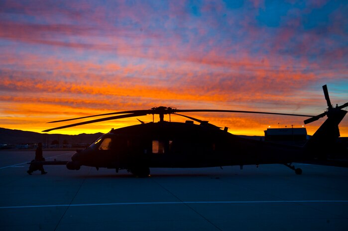A U.S. Air Force HH-60 Pave Hawk sits on the parking ramp during the terminal employment phase March 12, 2013, at Gowen Field, Idaho. The "T.E." mission objective is to demonstrate and instruct HH-60 Pave Hawk weapons employment and landing zone options to U.S. Air Force Weapons School students by maximizing weapons proficiency and quickly recover survivors. The phase is one out of a series of advanced training programs administered at the USAF Weapons School located at Nellis Air Force Base, Nev. (U.S. Air Force photo by Senior Airman Brett Clashman)