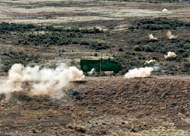 Rounds fired from an HH-60 Pave Hawk are fired at a pop-up target during the terminal employment phase March 11, 2013, at the Orchard Combat Training Center, Idaho. Pop-up targets of various kinds acted as threats during different events of the phase.  The "T.E." mission objective is to demonstrate and instruct HH-60 Pave Hawk weapons employment and landing zone options to U.S. Air Force Weapons School students by maximizing weapons proficiency and quickly recover survivors. The phase is one out of a series of advanced training programs administered at the USAF Weapons School located at Nellis Air Force Base, Nev. (U.S. Air Force photo by Senior Airman Brett Clashman)