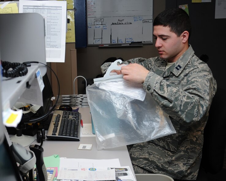 Capt. Aleksey Ushkin, 2nd Medical Support Squadron clinic pharmacist operations element chief, quality assures a prescription at the main pharmacy on Barksdale Air Force Base, La., March 27. The main and satellite pharmacies process more than 5,000 prescriptions each week. (U.S. Air Force photo/Senior Airman Sean Martin)