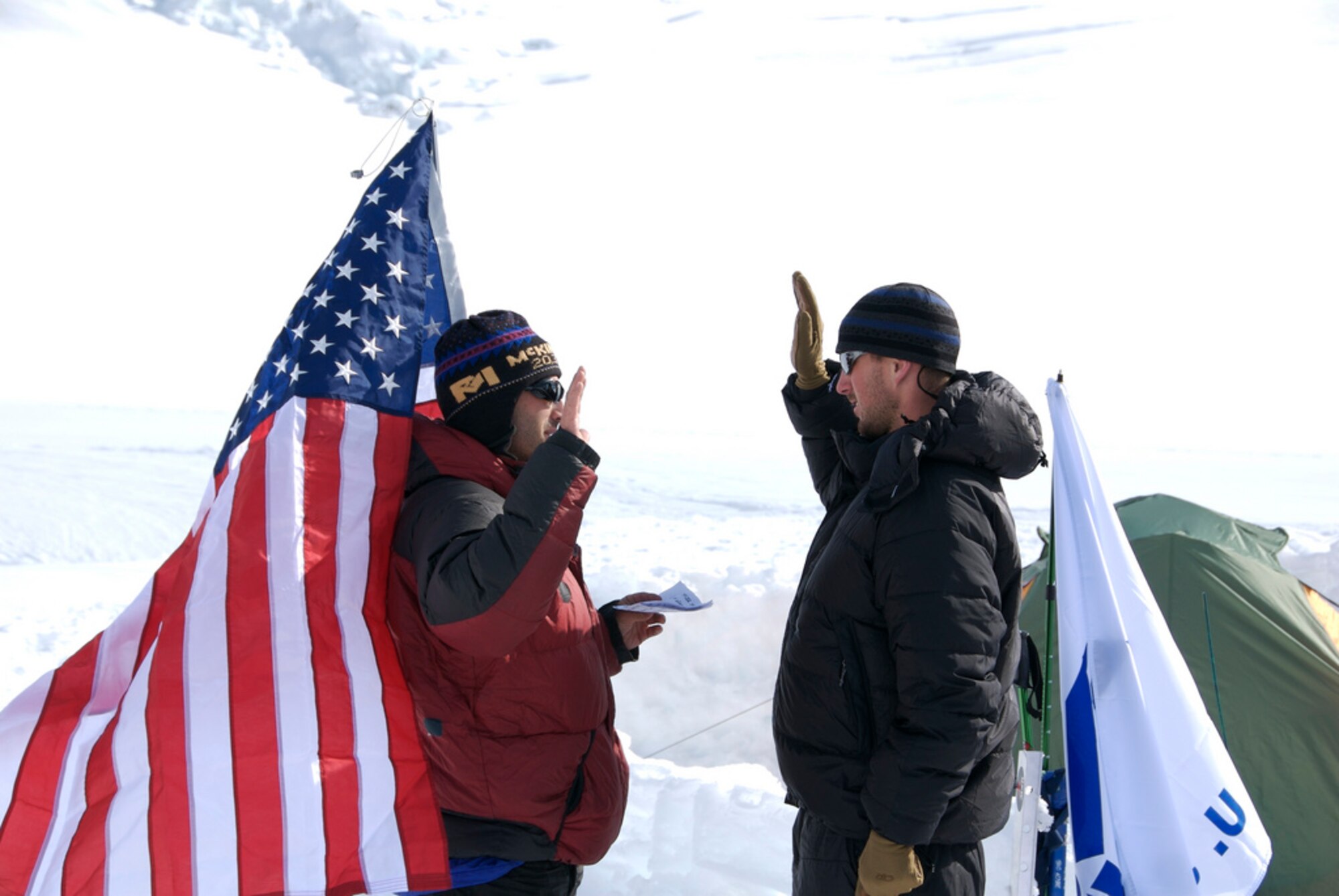 Lt. Tim Gannon is promoted to the rank of First Lieutenant by Capt. Mark Uberuaga at their second camp on Mount McKinley in 2008. As the team climbed on, just a short distance from the summit, they were treated to a surprise other team members had arranged: a roaring visit from the Air Force’s F-22 Raptor. In April of 2013, the team will attempt to climb to the summit of Mount Everest, the highest mountain in the world. (Courtesy photo)

