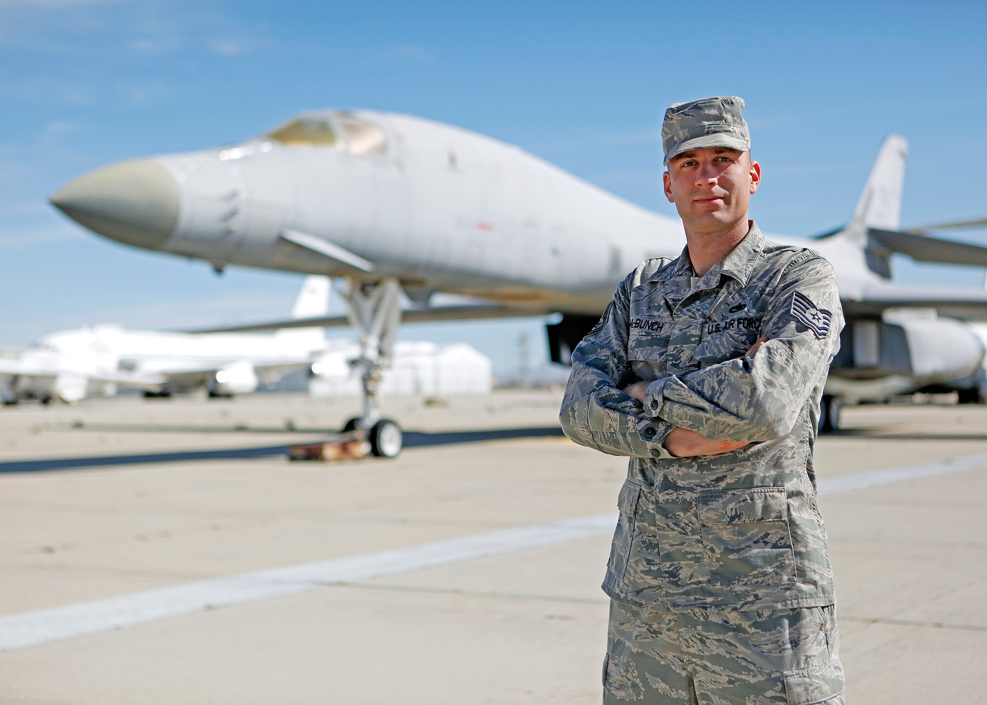 Tech. Sgt. Chad McBunch, 31st Test and Evaluation Squadron B-1 crew chief, stands in front of one of the first B-1s he worked on as a first-term Airman upon arriving at Edwards as a dedicated crew chief in 2002. (U.S. Air Force photo by Jet Fabara)