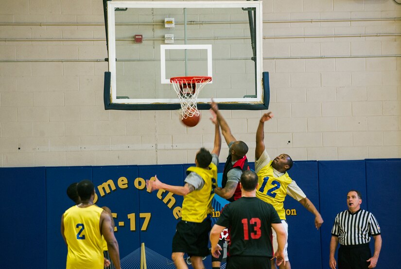 A member from the 628th Logistics Readiness Squadron basketball team scores during the Intramural Basketball Championship March 25, 2013, at Joint Base Charleston - Air Base, S.C. The 628th CES beat the 628th LRS 48 to 30 to become JB Charleston's basketball champions. (U.S. Air Force photo/ Senior Airman George Goslin)