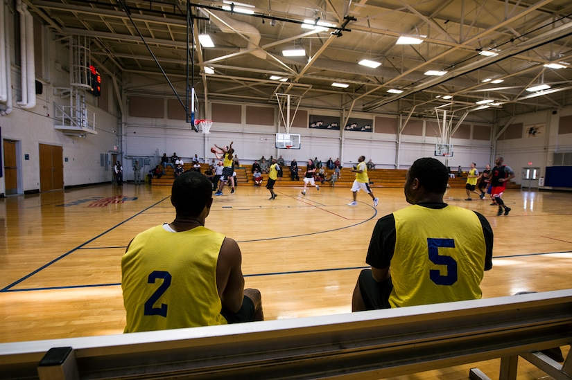 Players from the 628th Civil Engineer Squadron watch from the sidelines during the Intramural Basketball Championship March 25, 2013, at Joint Base Charleston - Air Base, S.C. The 628th CES beat the 628th LRS 48 to 30 to become JB Charleston's basketball champions. (U.S. Air Force photo/ Senior Airman George Goslin)