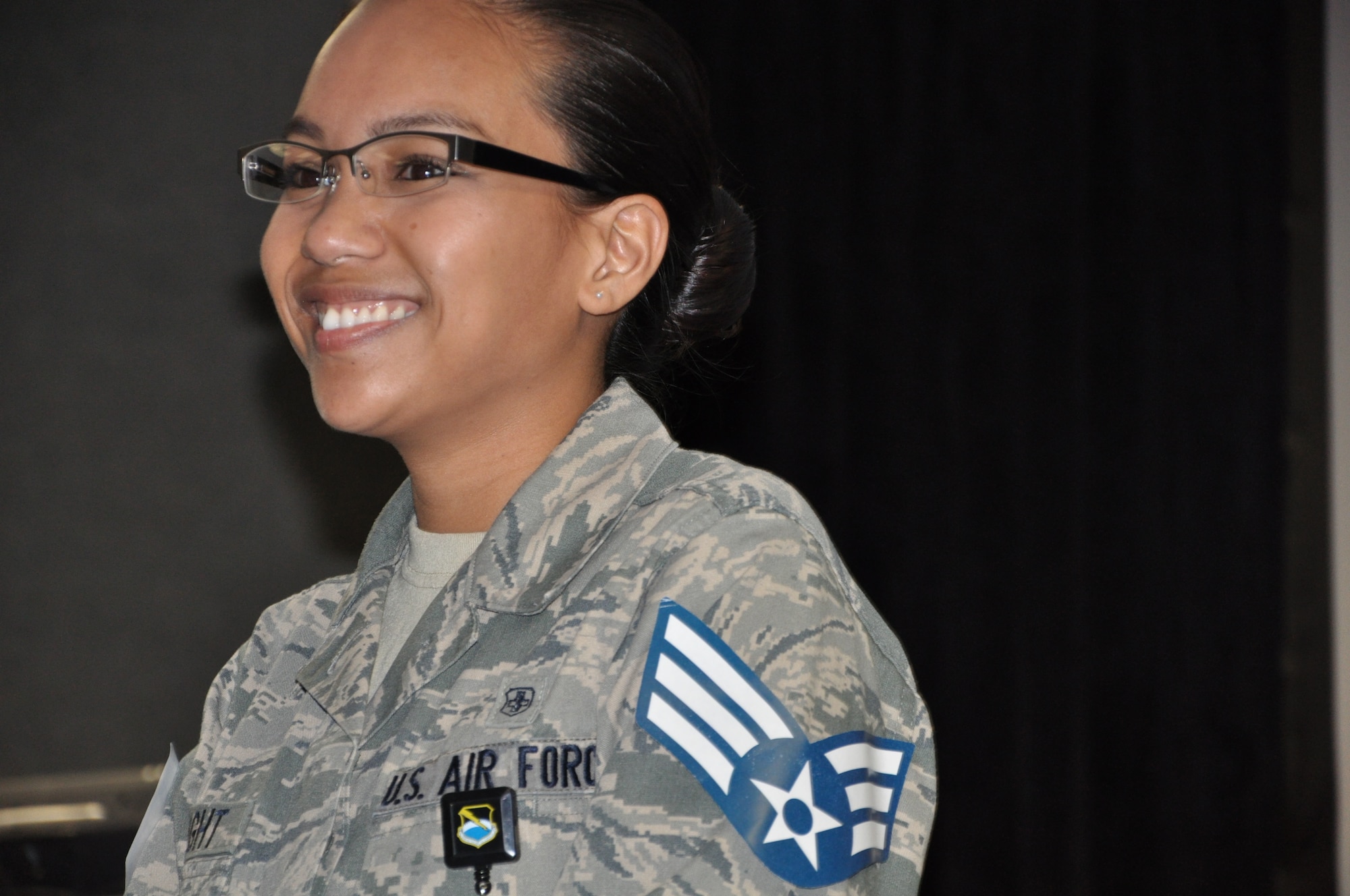 Airman 1st Class Lisette Wright, 325th Medical Operations Squadron Family Health medical technician, received the news of her below-the-zone promotion March 27 in front of a crowd of coworkers. The BTZ program allows those in the rank of Airmen 1st Class to be promoted to Senior Airmen six months before they normally would. (U.S. Air Force photo by Ashley M. Wright)