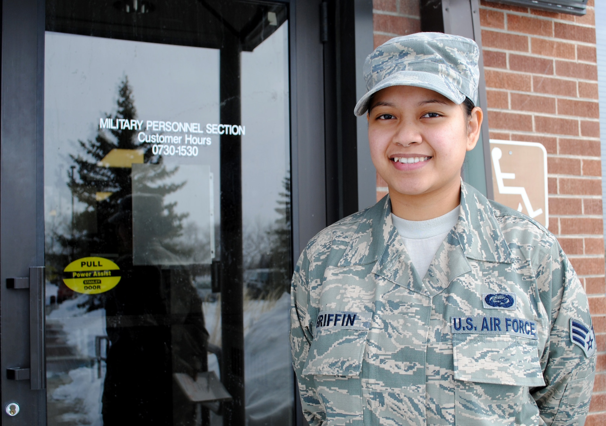 Senior Airman Delayne Griffin, a career development technician with 319th Force Support Squadron, poses for a photo at the entryway of the 319th FSS Military Personnel Section on Grand Forks Air Force Base, N.D. on March 25, 2013. Griffin was named the Grand Forks AFB’s Warrior of the North for the fourth Week of March 2013. (U.S. Air Force photo/Staff Sgt. Luis Loza Gutierrez)

