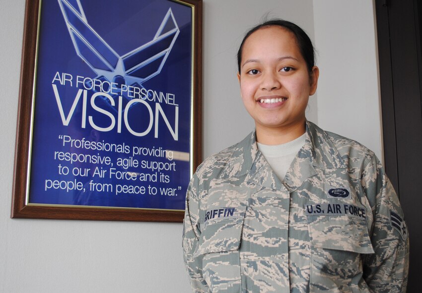 Senior Airman Delayne Griffin, a career development technician with 319th Force Support Squadron, poses for a photo at the entryway of the 319th FSS Military Personnel Section on Grand Forks Air Force Base, N.D. on March 25, 2013. Griffin was named the Grand Forks AFB’s Warrior of the North for the fourth Week of March 2013. (U.S. Air Force photo/Staff Sgt. Luis Loza Gutierrez)
