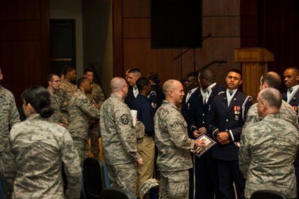 Air Force Honor Guard members answer questions from Joint Base Charleston Airmen during a recruiting visit March 25, 2013, at JB Charleston – Air Base, S.C. The AF Honor Guard visited JB Charleston to recruit members for their team. (U.S. Air Force photo/ Senior Airman George Goslin)
