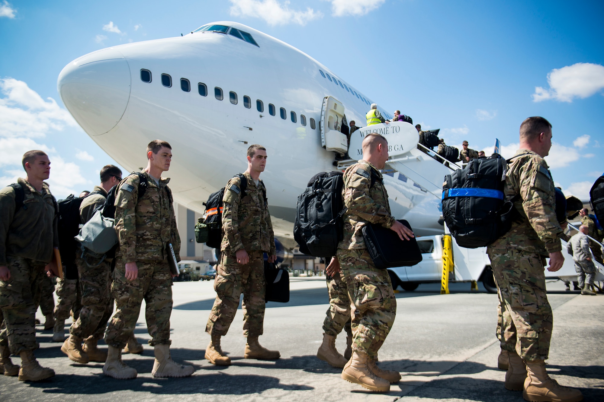 Airmen board a Boeing 747 March 26, 2013, at Moody Air Force Base, Ga. Approximately 350 Airmen left Moody for a six-month deployment to Southwest Asia. (U.S. Air Force photo by Staff Sgt. Jamal D. Sutter/Released)