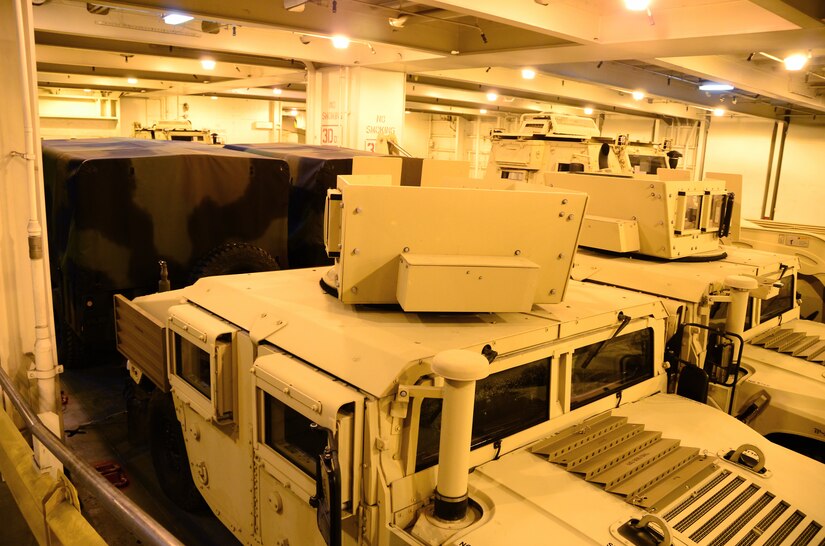 A variety of military vehicles fill the hold of USNS Soderman (T-AKR 317) March 21, 2013, at Wharf Alpha on Joint Base Charleston – Weapons Station, S.C.  Once loaded, the vessel will contain more than 10,000 long tons of cargo and be prepositioned overseas. (U.S. Air Force photo/Staff Sgt. William O'Brien)