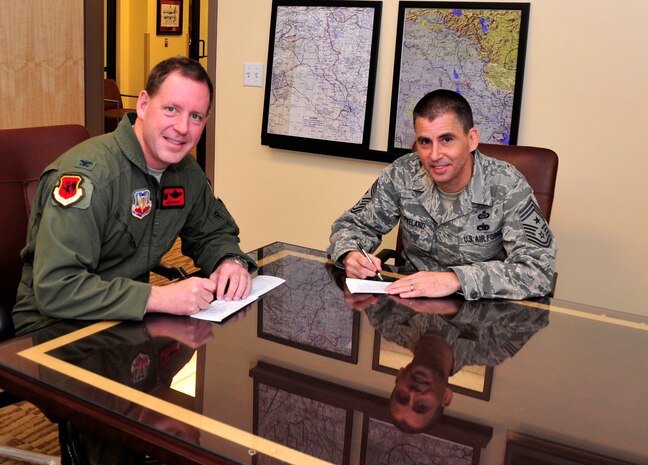 432nd Wing, 432nd Air Expeditionary Wing leadership sign
donation forms, kicking off the annual Air Force As-sistance Fund campaign.
The purpose of the six-week campaign is to raise funds for Airmen, widows
and widowers in need of financial assistance. For more information, visit
http://www.afassistancefund.org/.  (U.S. Air Force photo by Senior Airman
A.K.)