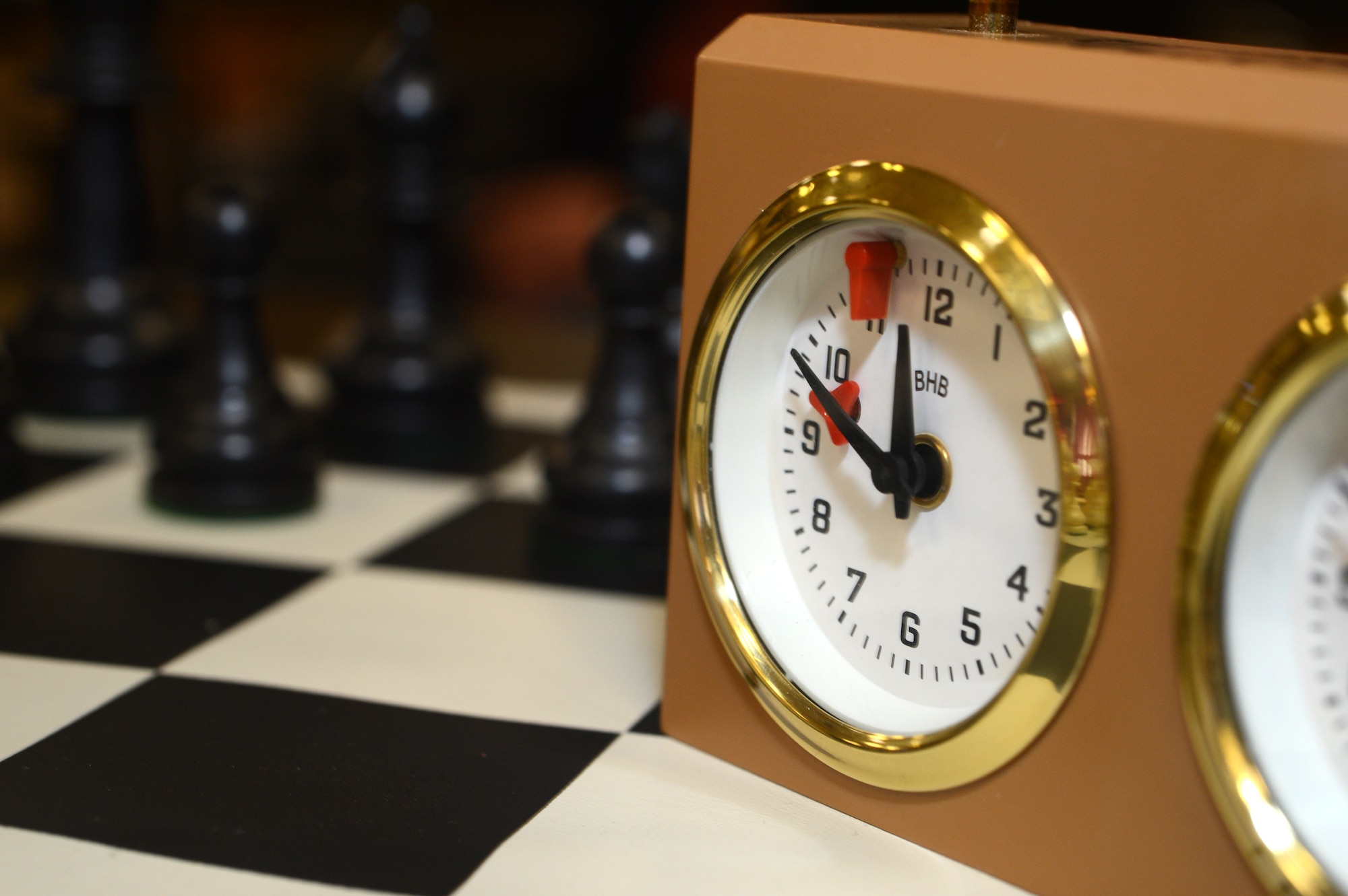 SPANGDAHLEM AIR BASE, Germany – A clock sits on a chess board at the chess tournament March 24, 2013, in the Brick House at Spangdahlem Air Base. The clocks are used to limit the amount of time spent on a game, not an individual move. (U.S. Air Force photo by Airman 1st Class Kyle Gese/Released)
