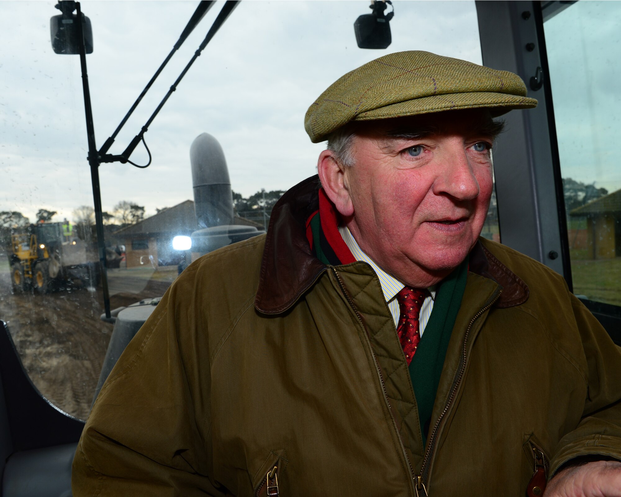 ROYAL AIR FORCE LAKENHEATH, England – Squadron Leader (retired) Rob Williams, 494th Fighter Squadron honorary commander, drives a grader during an immersion tour March 21, 2013. The honorary commanders were able to view equipment demonstration by the 48th Civil Engineer Squadron heavy equipment shop and drive the different utility vehicles. (U.S. Air Force photo by Staff Sgt. Stephanie Mancha)