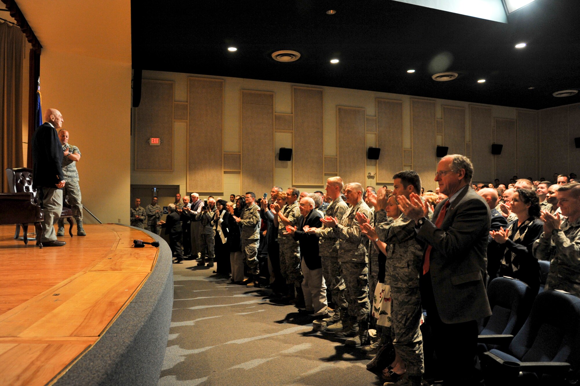 Team Goodfellow and San Angelo community members give U.S. Army Air Force retired Lt. Col. Richard Cole, Doolittle Raider, a standing ovation at the Goodfellow Air Force base theater March 26, 2013. Cole was the co-pilot of the famous Gen. Jimmy Doolittle B-25 plane #1 and is one of the four remaining Doolittle Raiders. (U.S. Air Force photo/ Airman 1st Class Michael Smith)